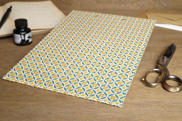Clipboard covered with beautiful colored paper, solidly built, durable
